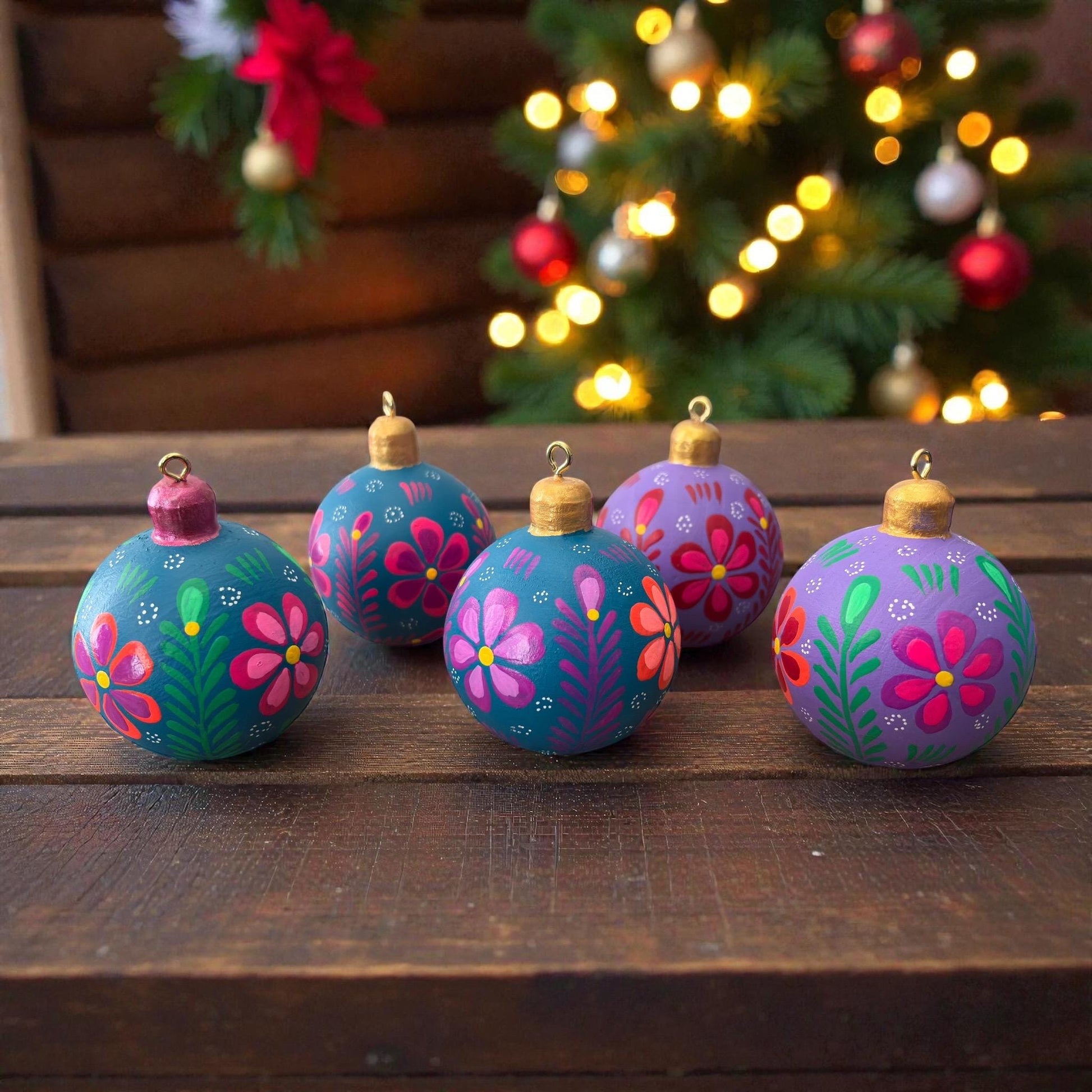 Hand-painted multicolor wooden Christmas ornaments with floral design, handmade in Oaxaca, Mexico