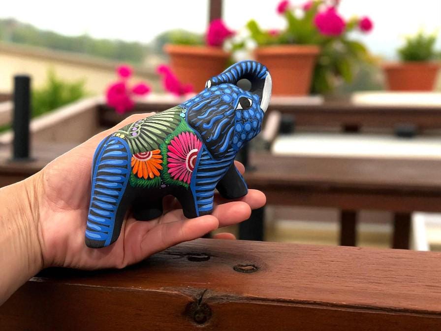 Colorful elephant alebrije sculptures side by side, handmade Mexican folk art from Guanajuato