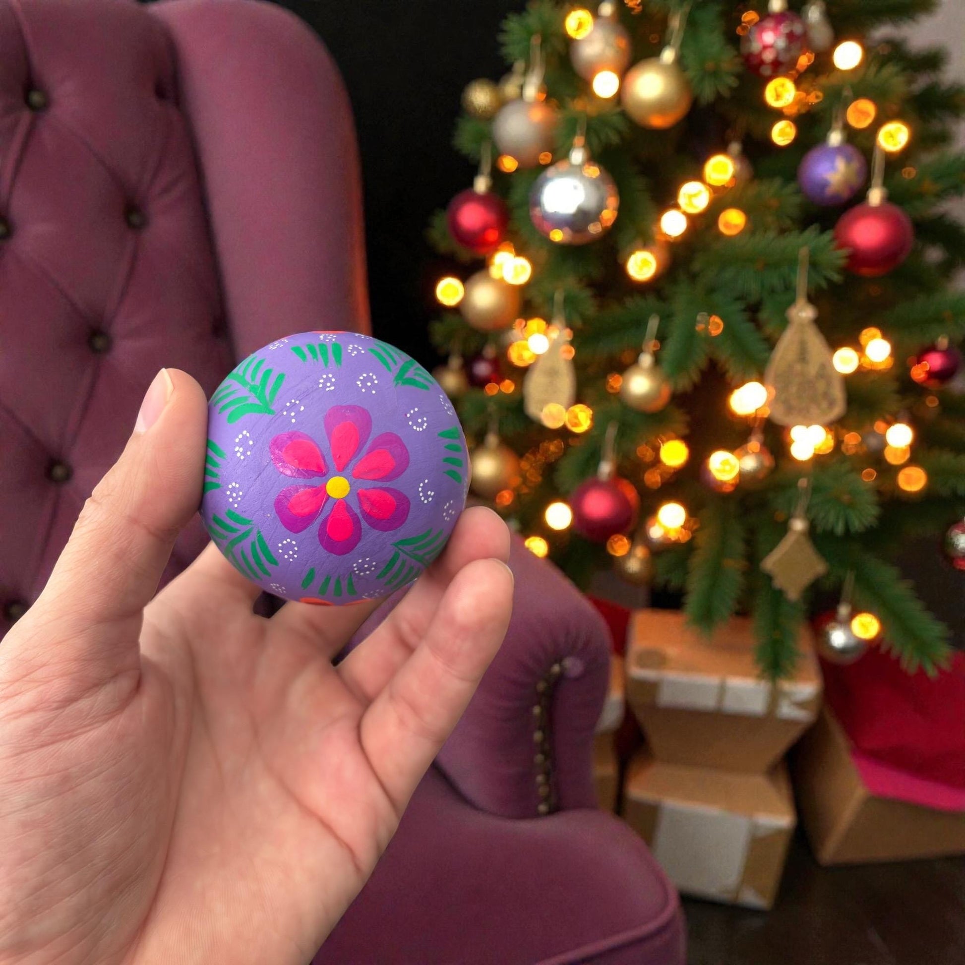 Handmade Mexican wooden Christmas ornaments with multicolor floral design