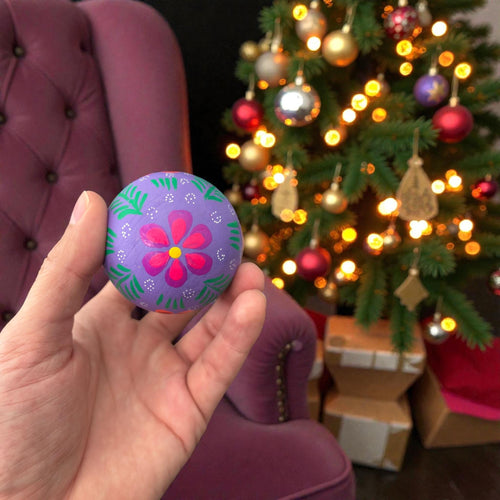 Handmade Mexican wooden Christmas ornaments with multicolor floral design