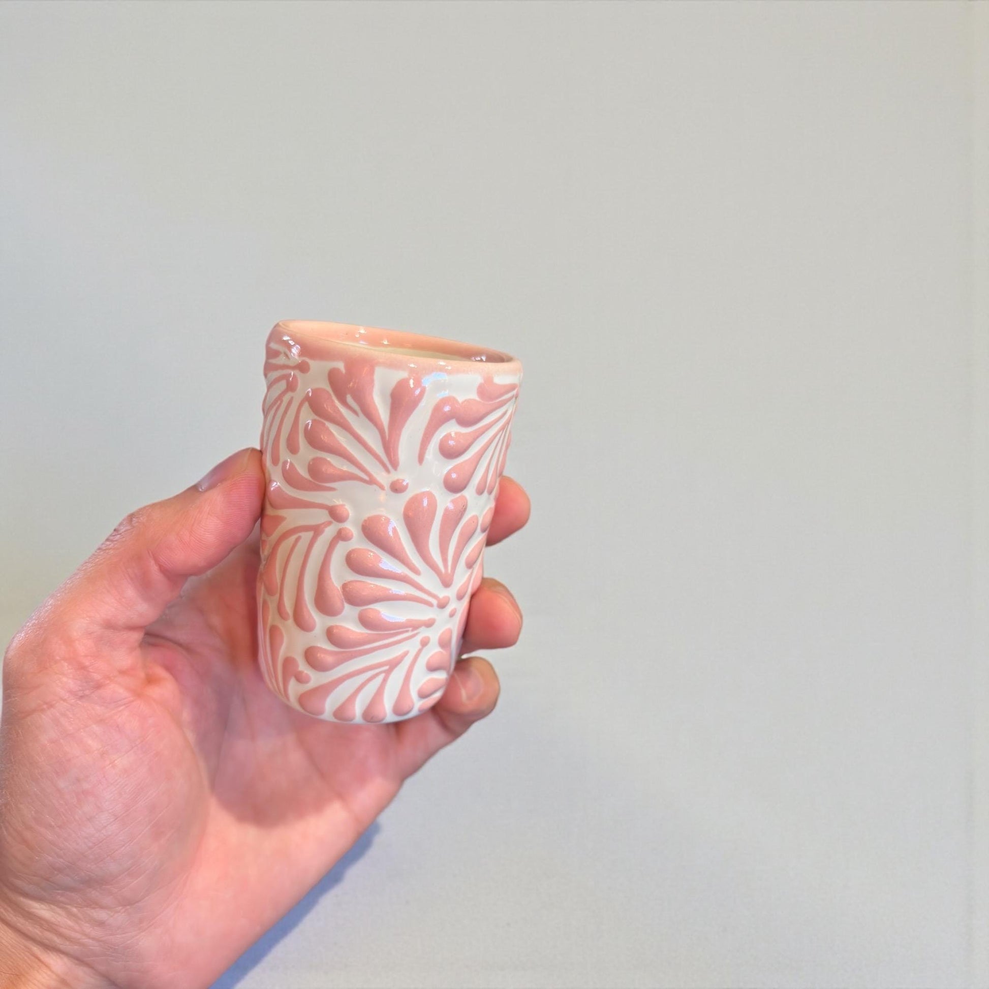Colorful Talavera shot glasses in black, pink and blue, handmade Mexican pottery