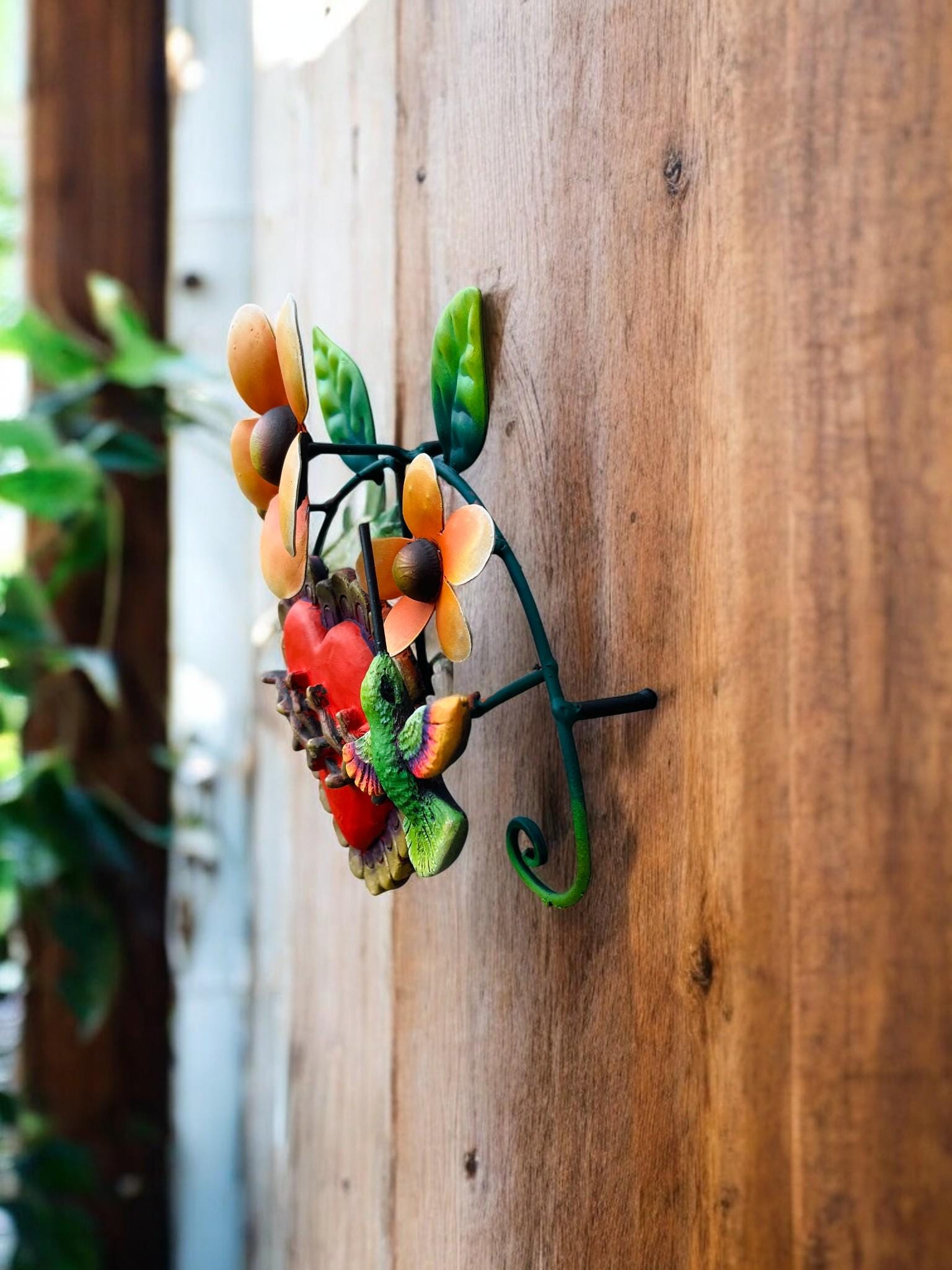 Red heart metal wall decor with green hummingbird, hand-painted Mexican folk art
