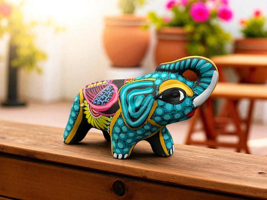 Handmade clay elephant alebrije with traditional Mexican folk art painting