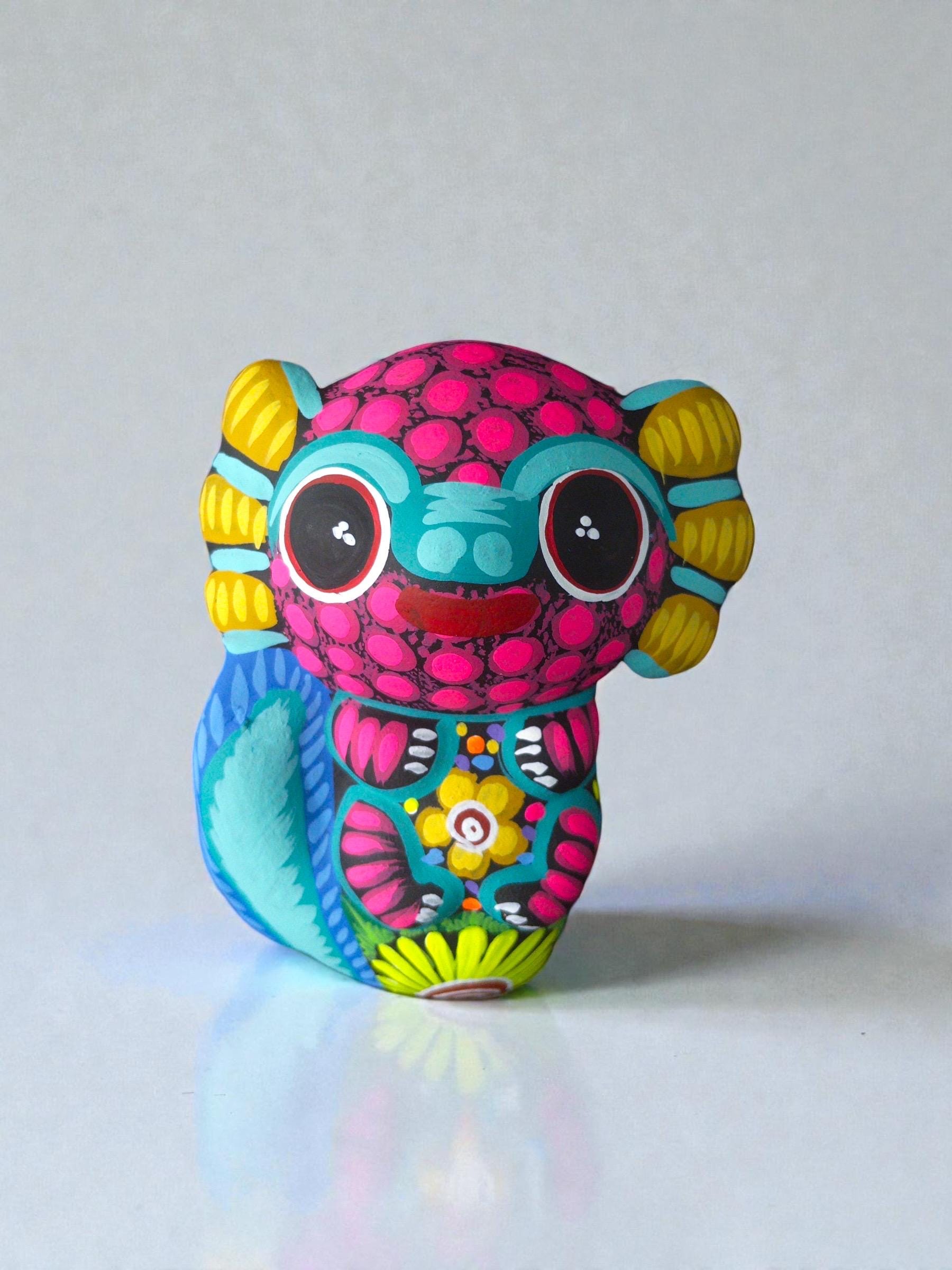 Pink axolotl alebrije detail, handpainted clay Mexican folk art