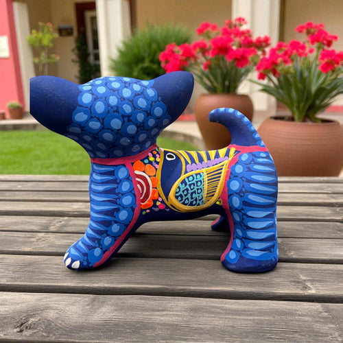 Colorful dog alebrije displayed outdoors with flowers, Mexican folk art sculpture