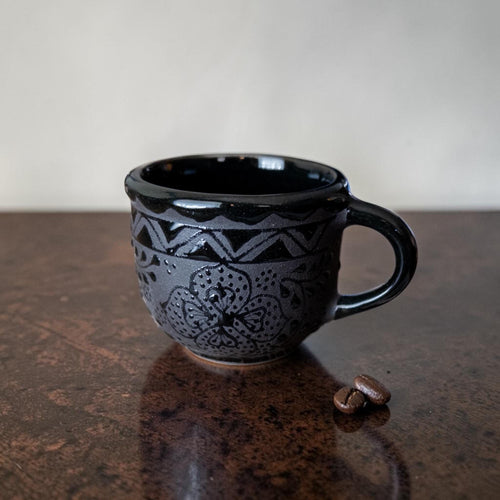 Handmade black espresso cup top view
