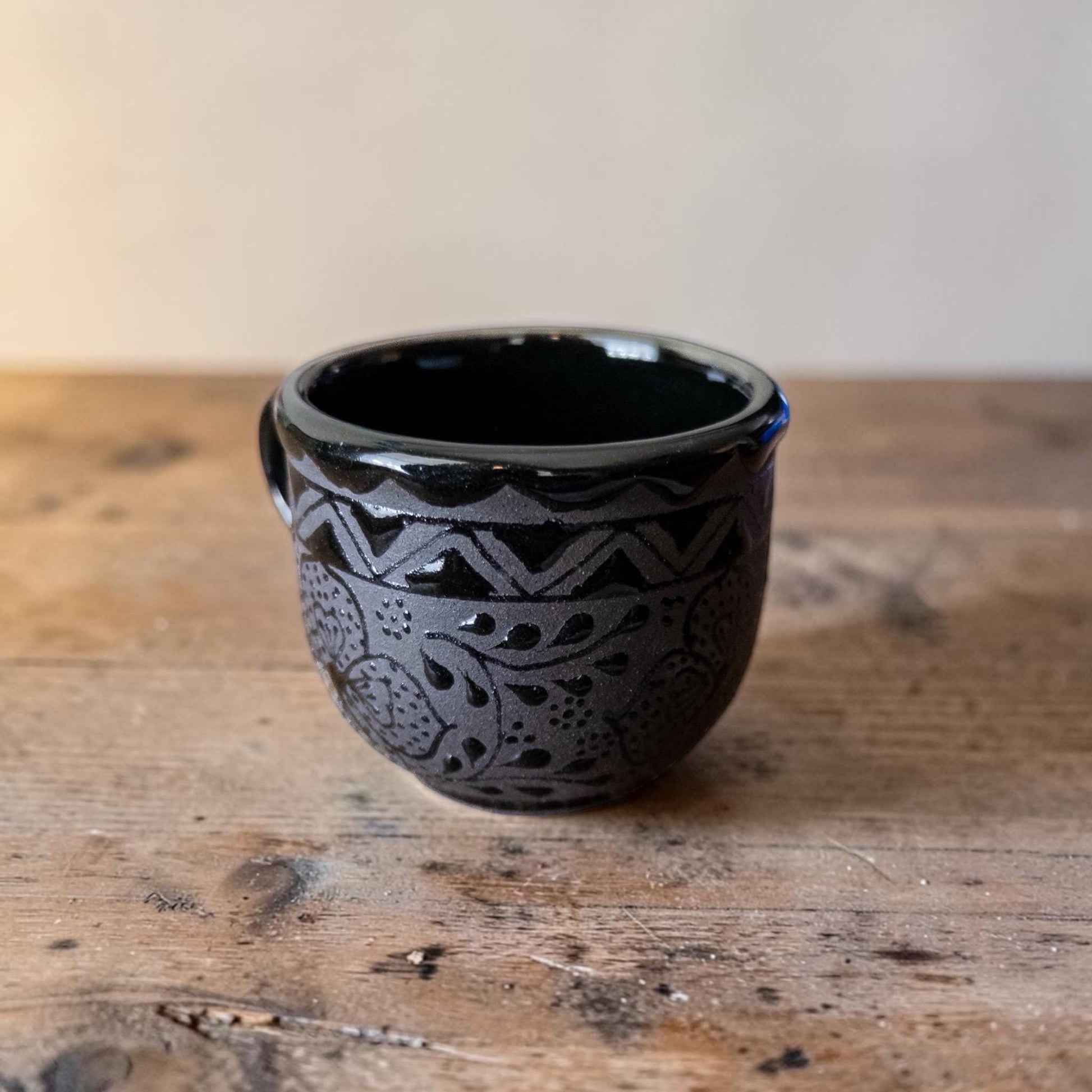Black espresso cup glaze detail - Mexican pottery