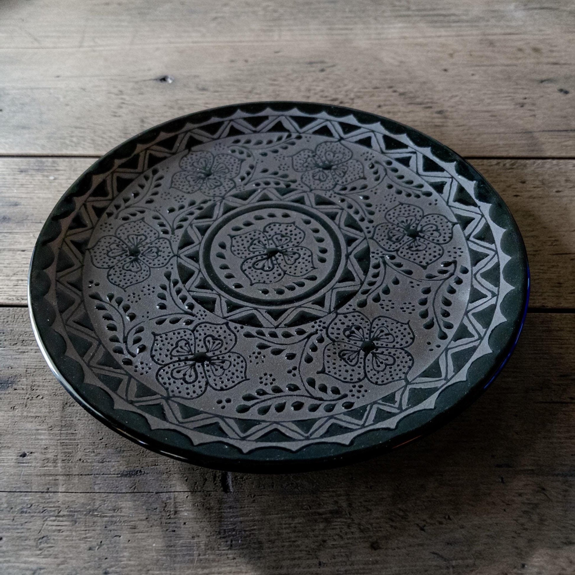 Black stoneware dinner plate top view handmade
