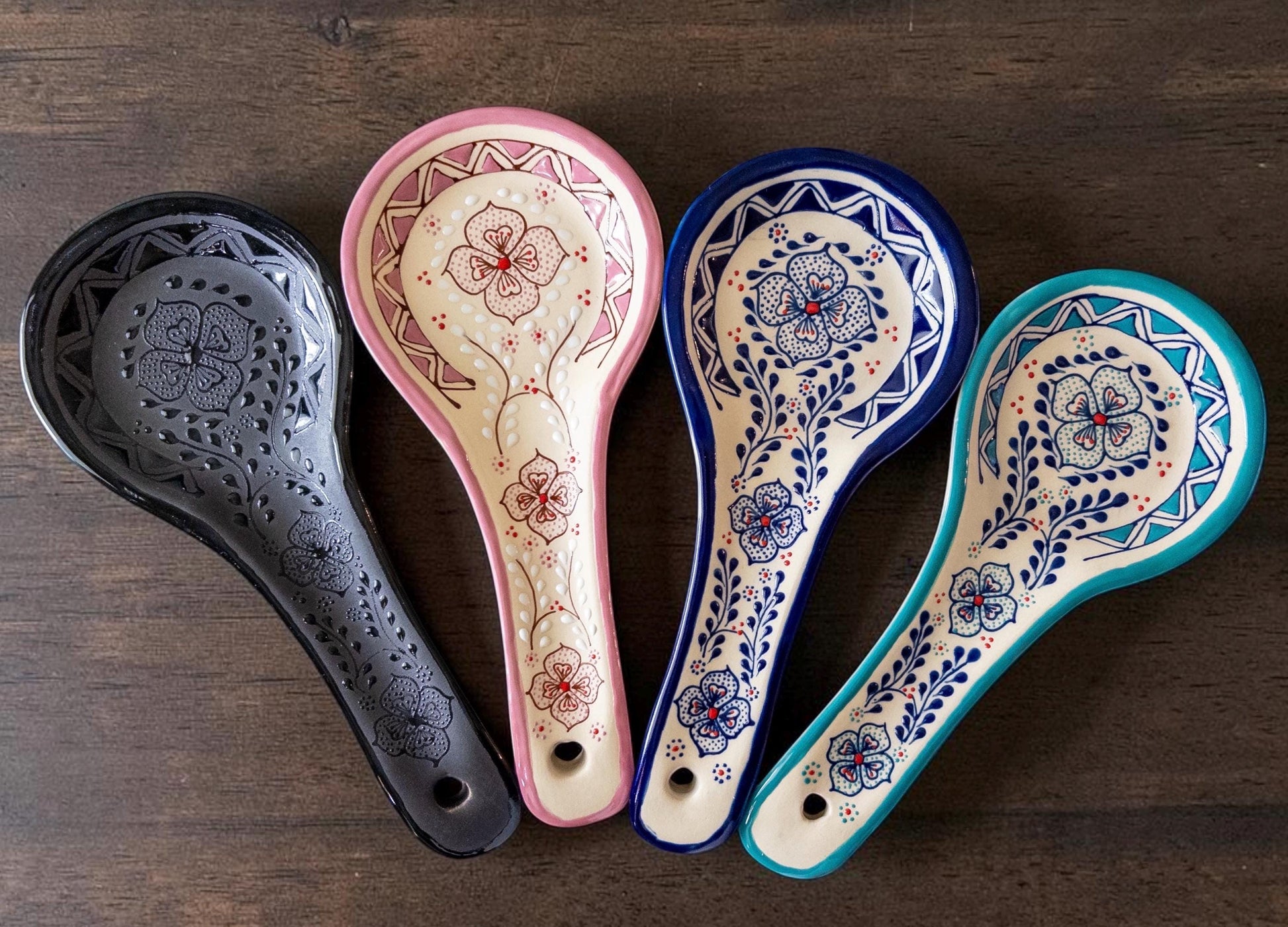 Black stoneware spoon rest on kitchen counter