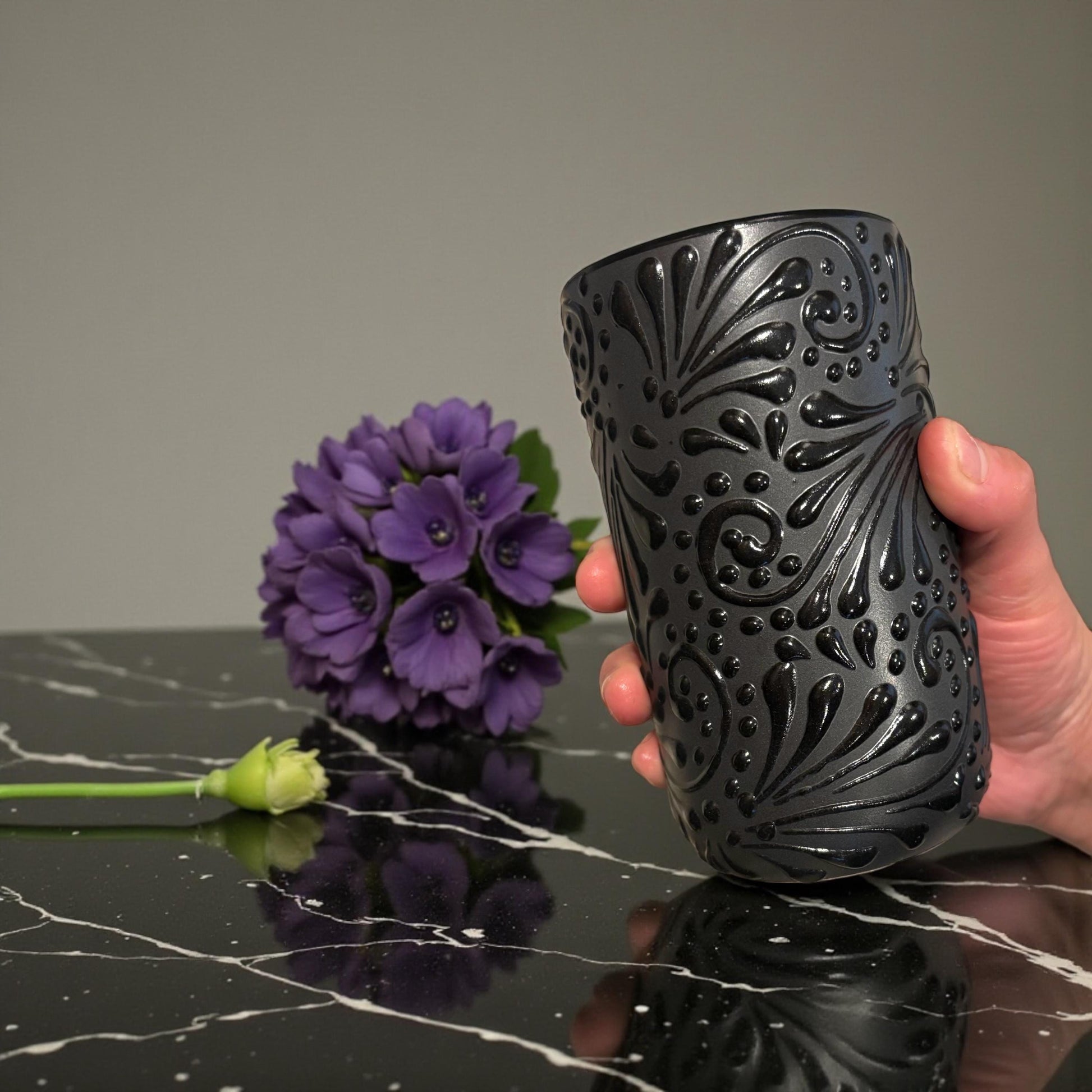 Black Talavera clay cup handmade in Mexico with hand-painted floral relief