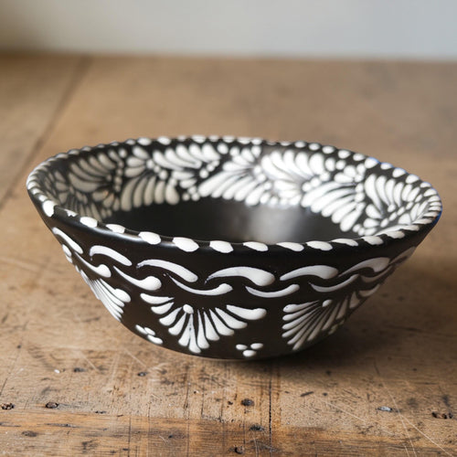 Black Talavera plate with white floral hand-painted pattern