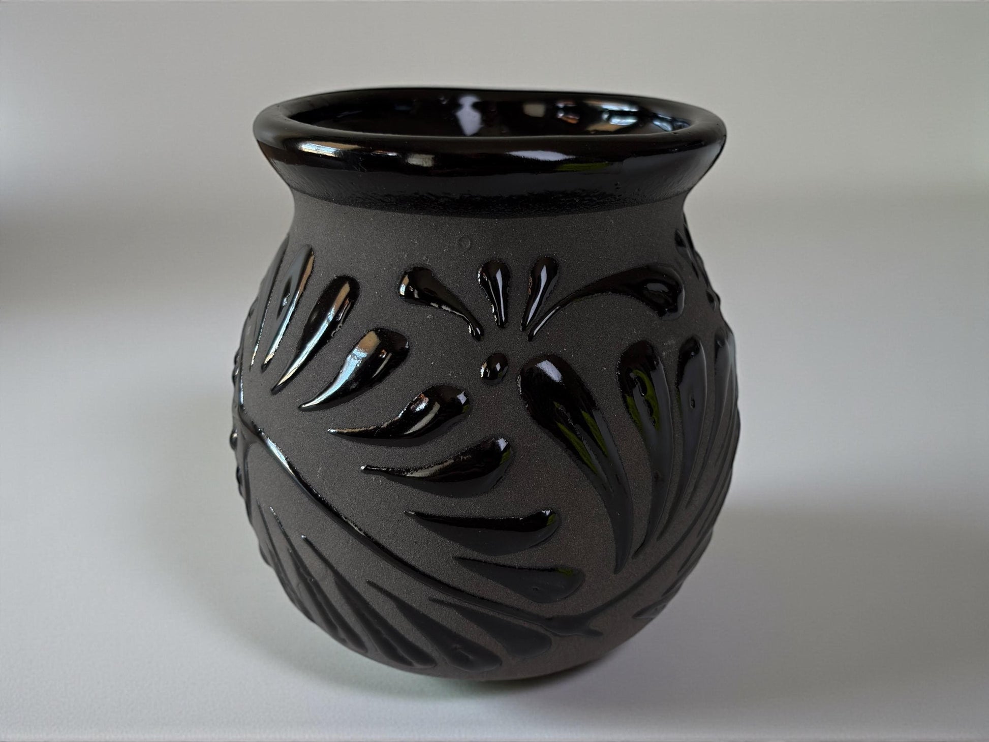 Set of black Talavera jarritos stacked