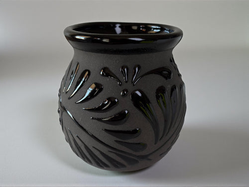 Set of black Talavera jarritos stacked