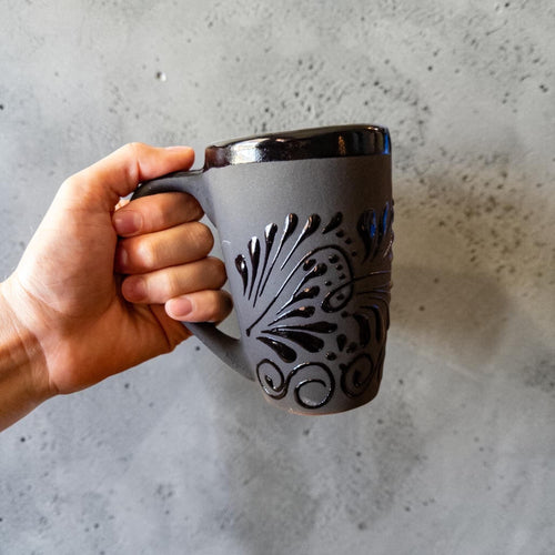 Handmade black Talavera mug with artisan detailing
