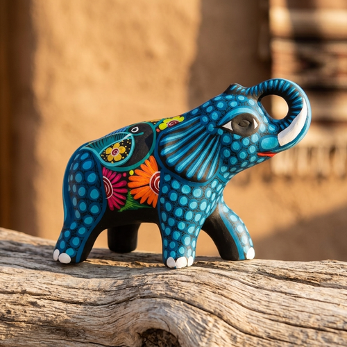 Hand-painted blue elephant alebrije clay sculpture with floral and dotted patterns, Mexican folk art
