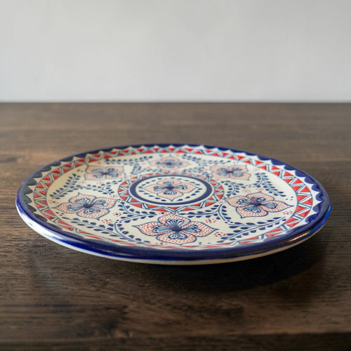 Blue and red stoneware dinner plate top view handmade