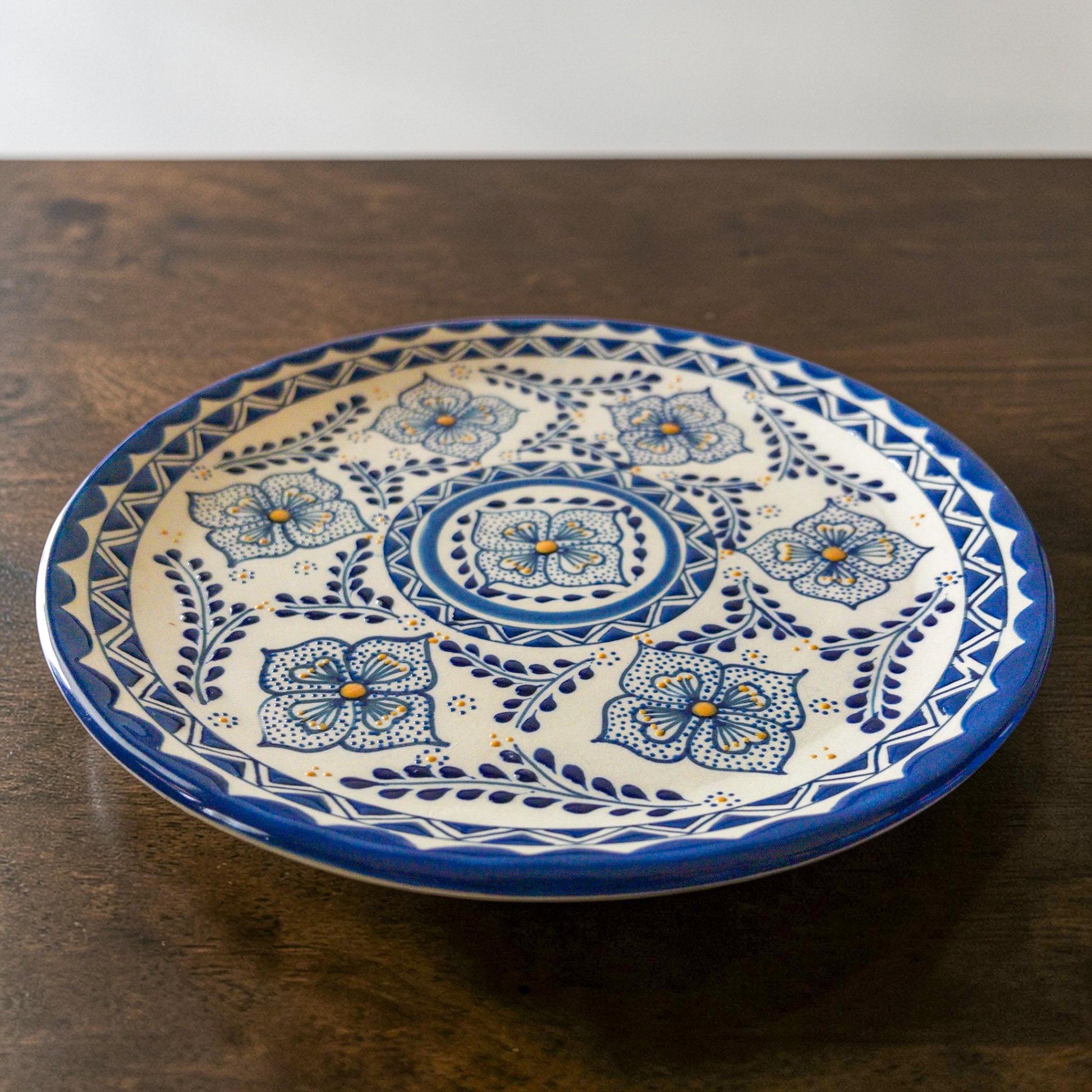 Blue stoneware dinner plate hand-painted detail
