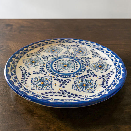 Blue stoneware dinner plate hand-painted detail