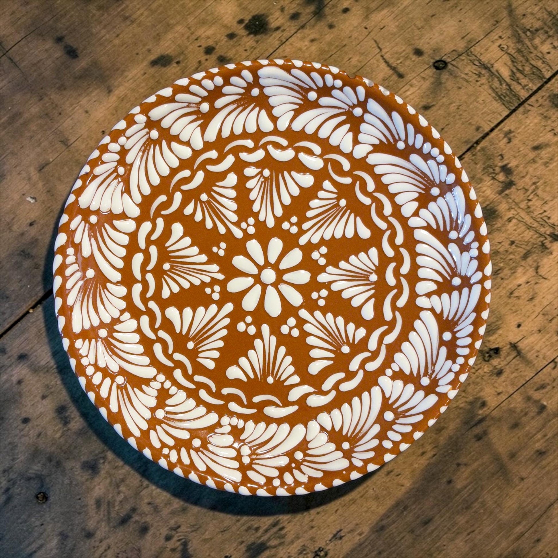 Brown Talavera serving plate held in hand, handmade Mexican pottery