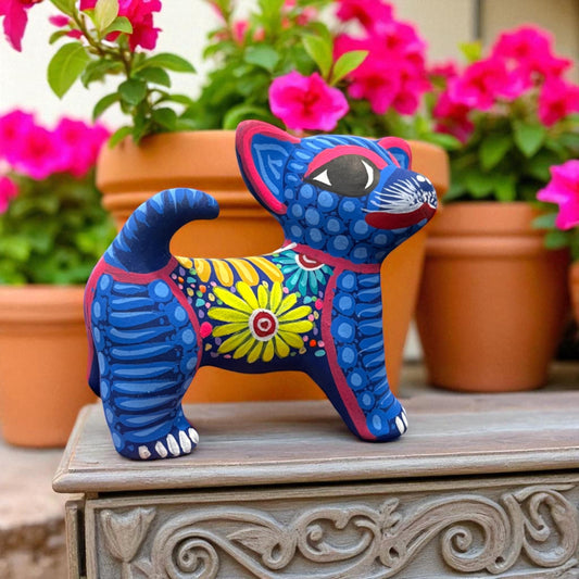 Handmade dog alebrije with colorful patterns, Mexican clay folk art figurine