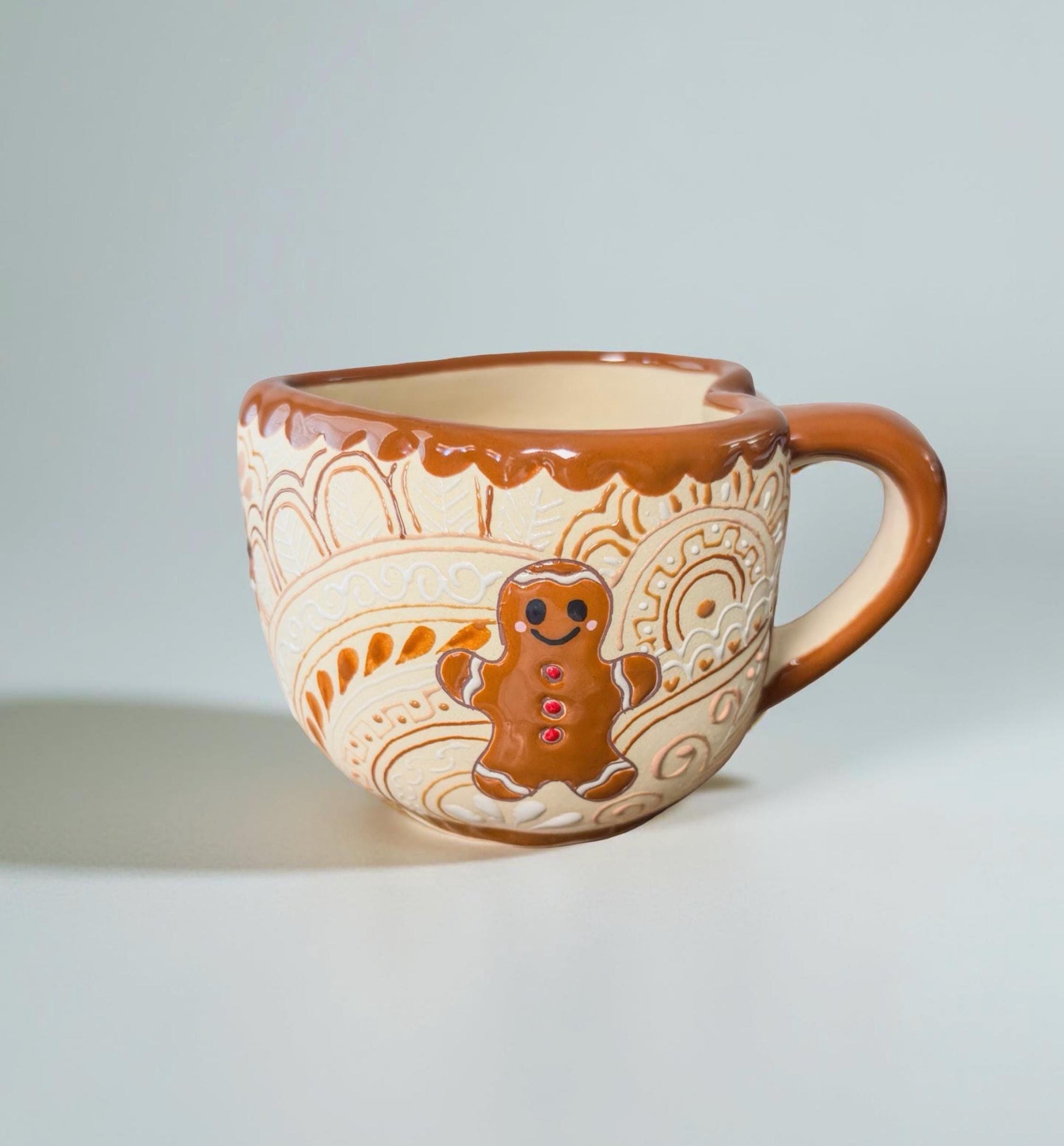 Festive gingerbread man stoneware mug with hot cocoa