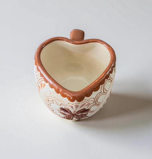 Gingerbread man mug top view showing heart-shaped rim, handmade pottery
