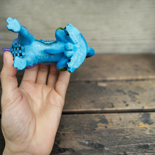 Hand-carved copal wood dog alebrije, side view