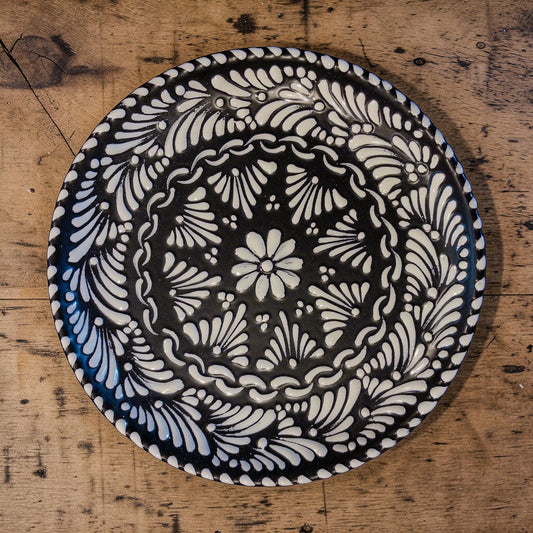 Black handmade talavera plate with floral design