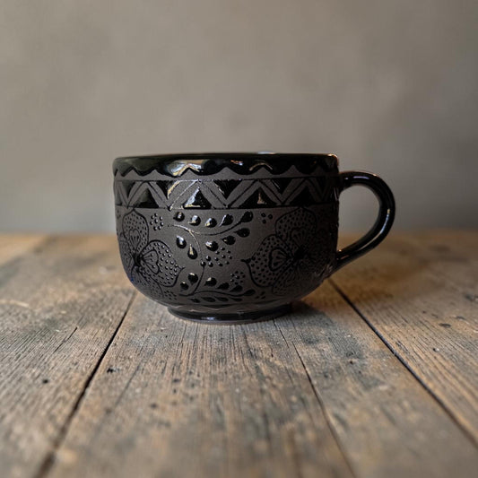Black stoneware soup mug filled with soup