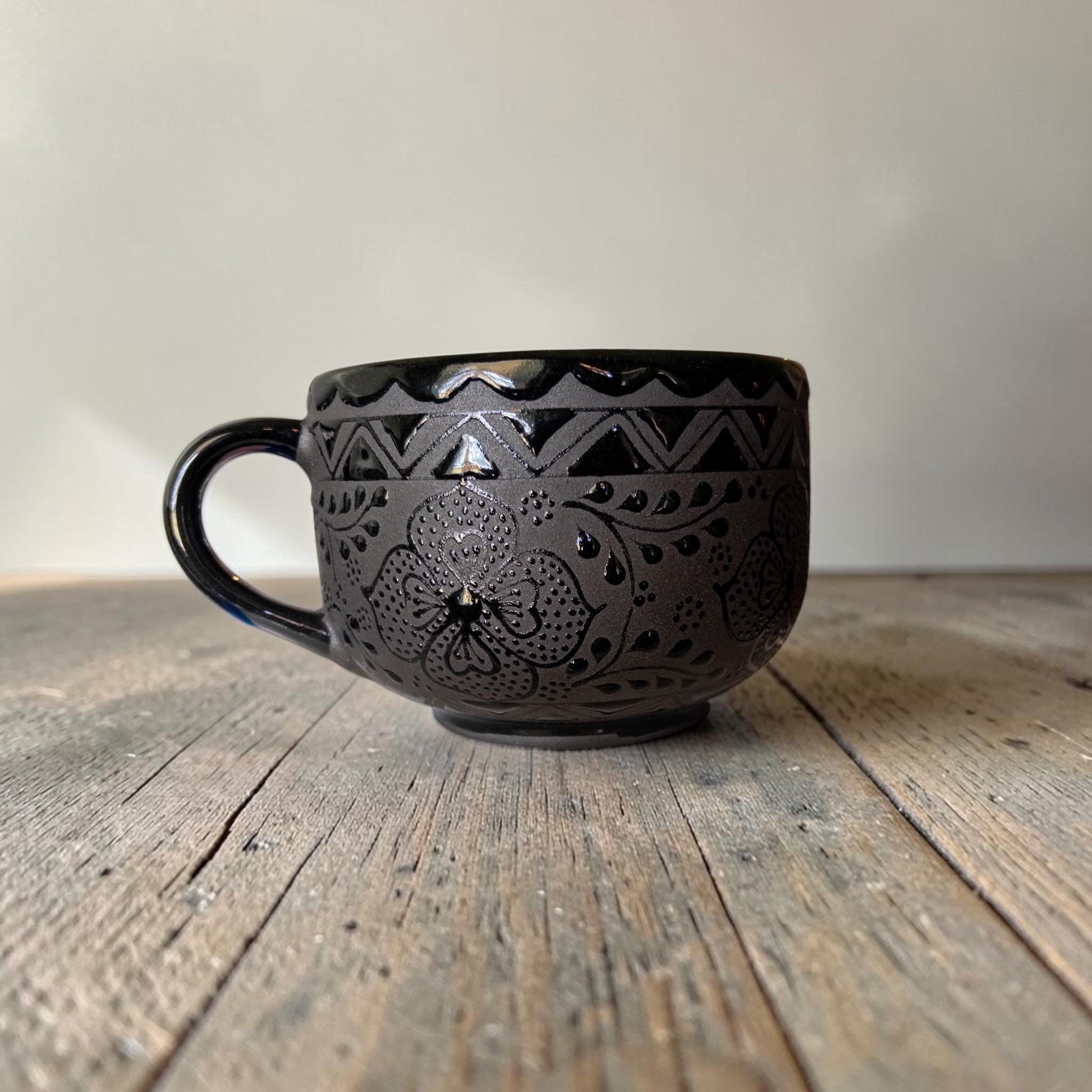 Large black stoneware mug side view