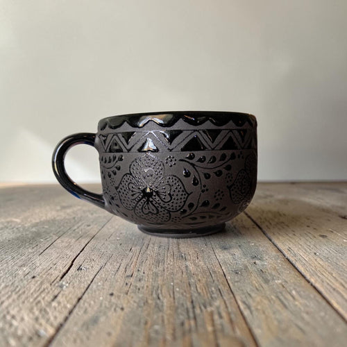Large black stoneware mug side view