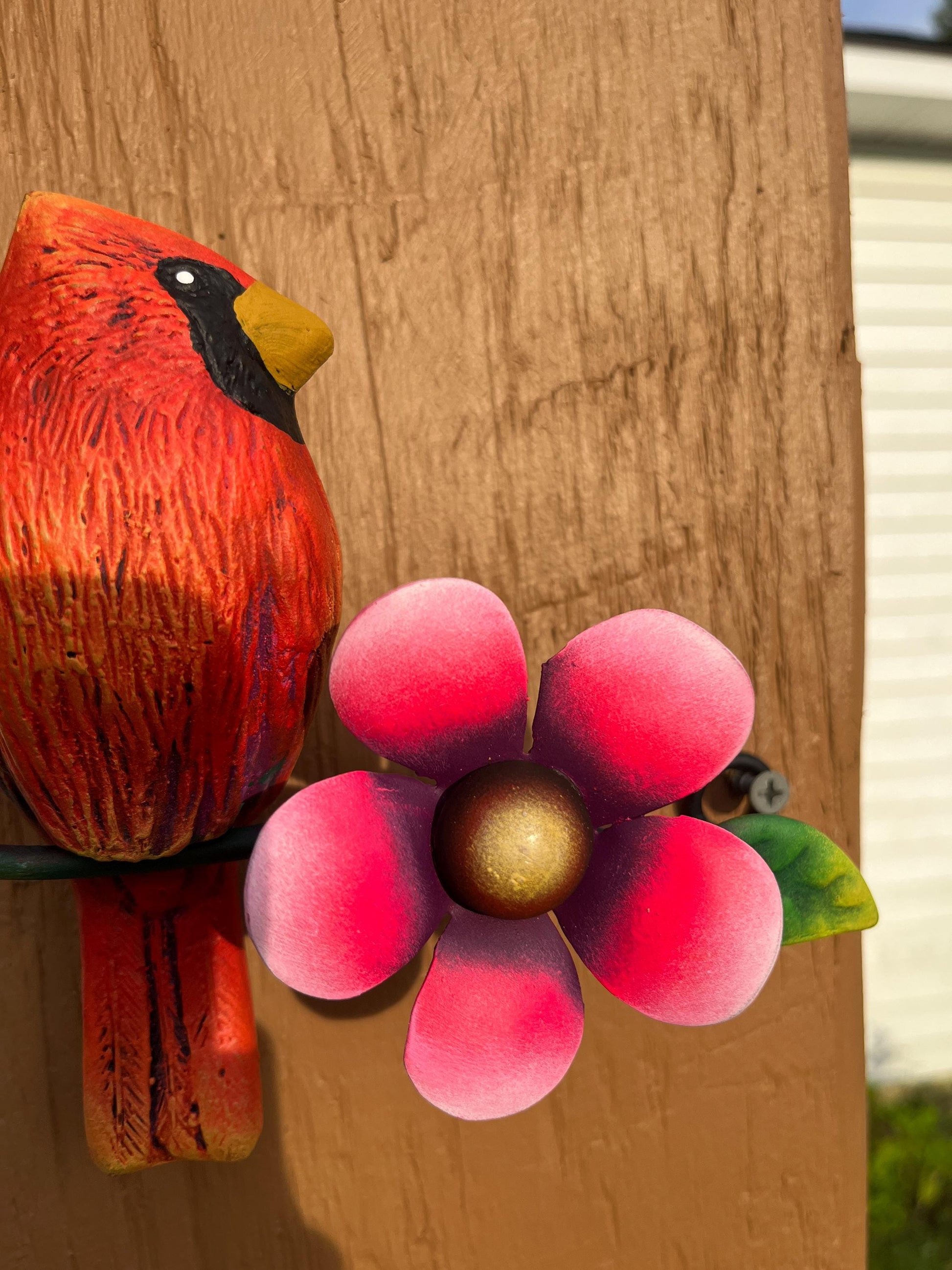 Red metal cardinal hanging on wall, handmade Mexican wall decor
