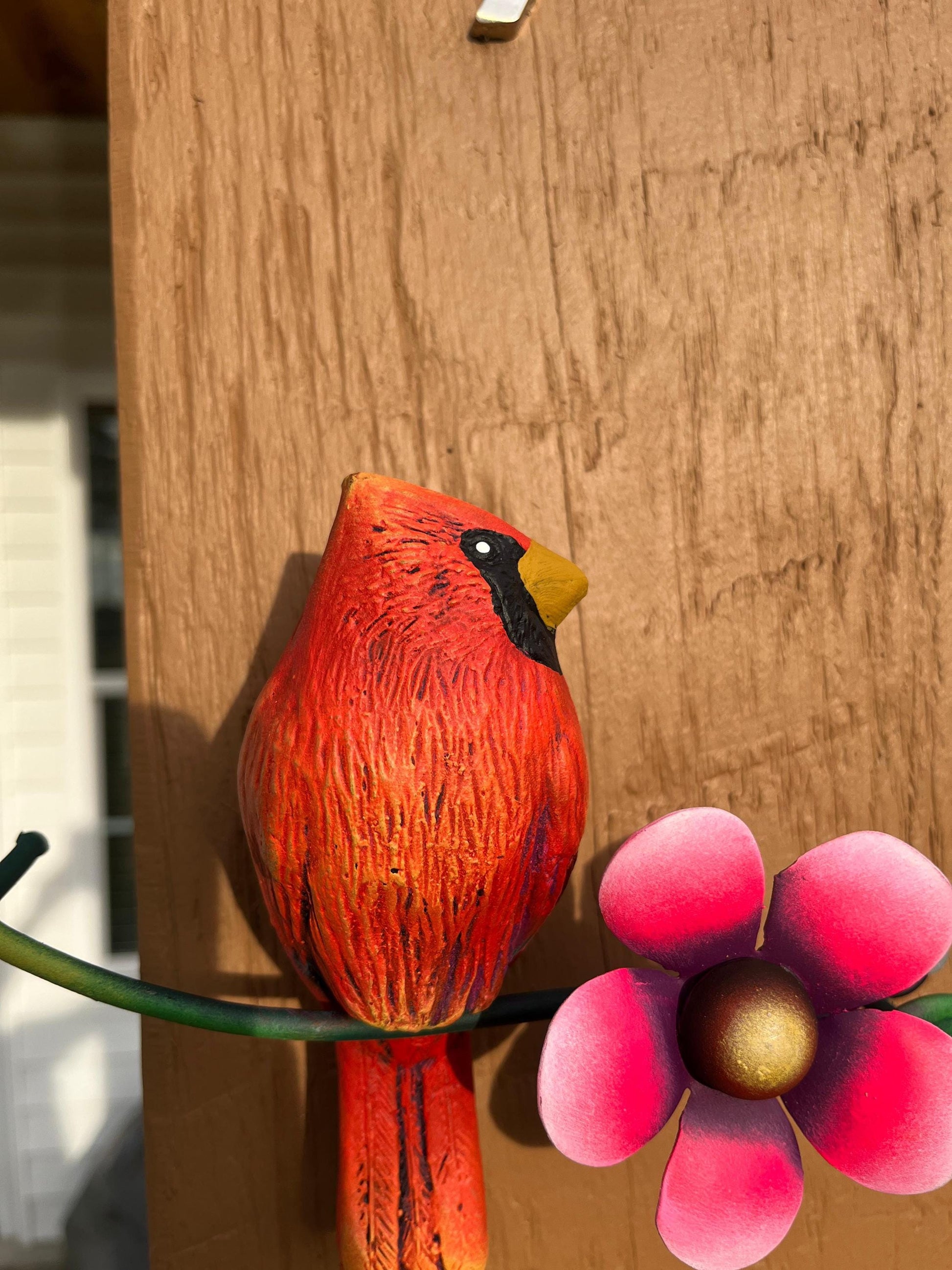 Red metal cardinal wall art detail, handmade Mexican folk art