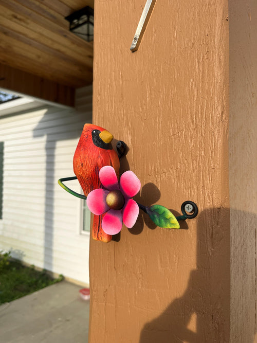 Red metal cardinal wall decor angled view, handmade Mexican wall art