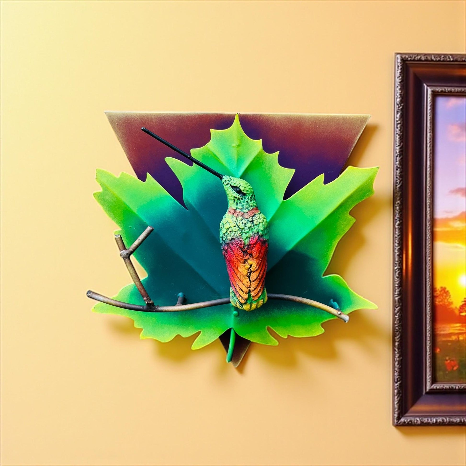 Green metal hummingbird wall art detail, handmade Mexican folk art