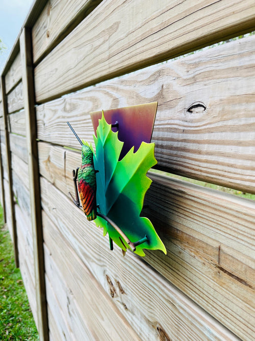 Green metal hummingbird wall art metalwork detail, handmade in Mexico
