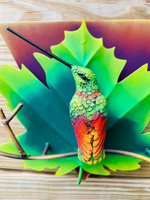 Green metal hummingbird wall art side view, handmade Mexican wall decor