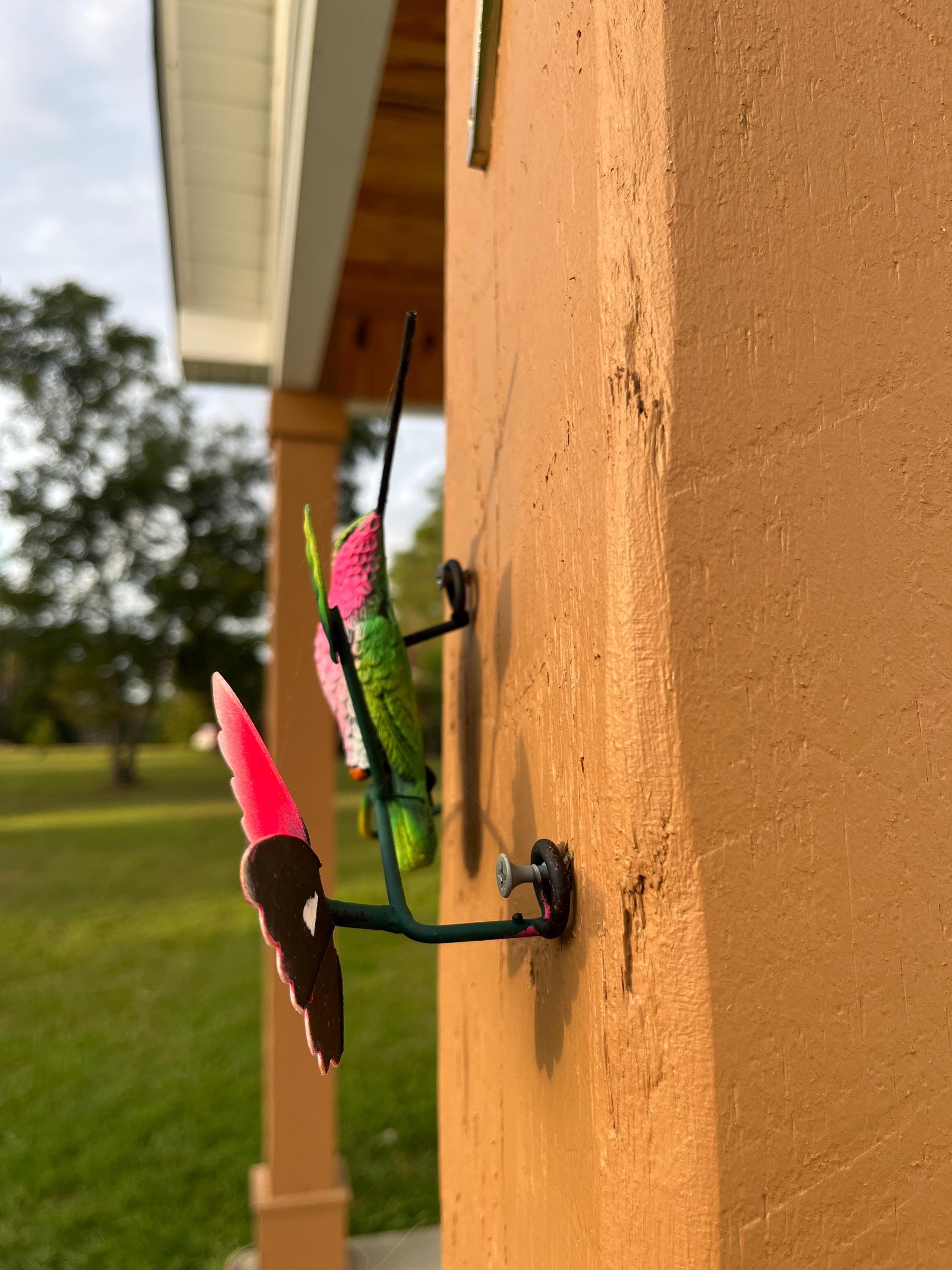 Green and pink metal hummingbird wall decor side view, handmade Mexican wall art