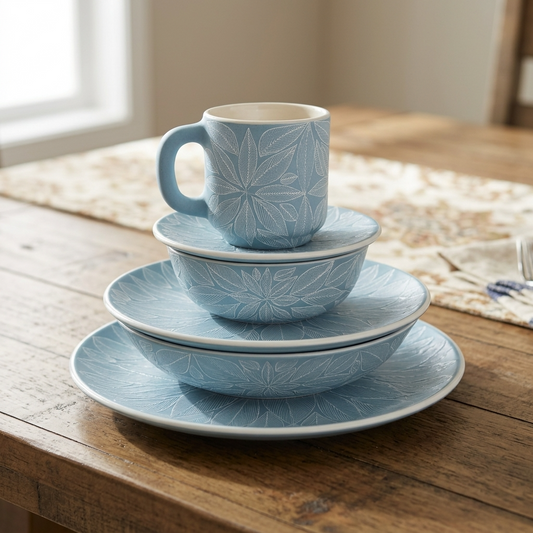 Mexican stoneware dinnerware set with plates, bowls and mug on table