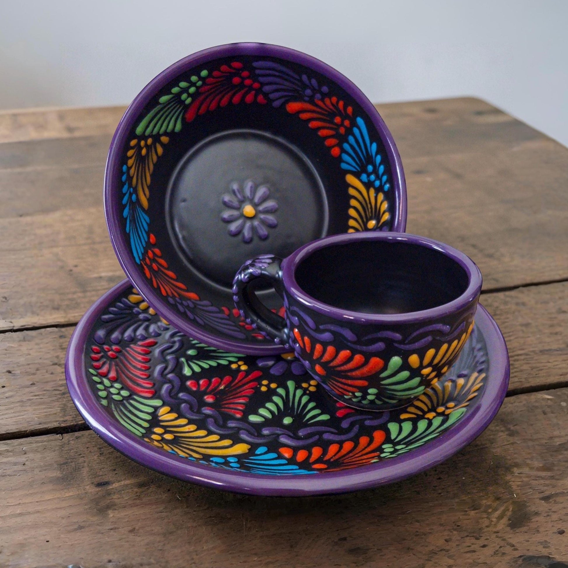 Black Mexican pottery dinnerware set with intricate patterns