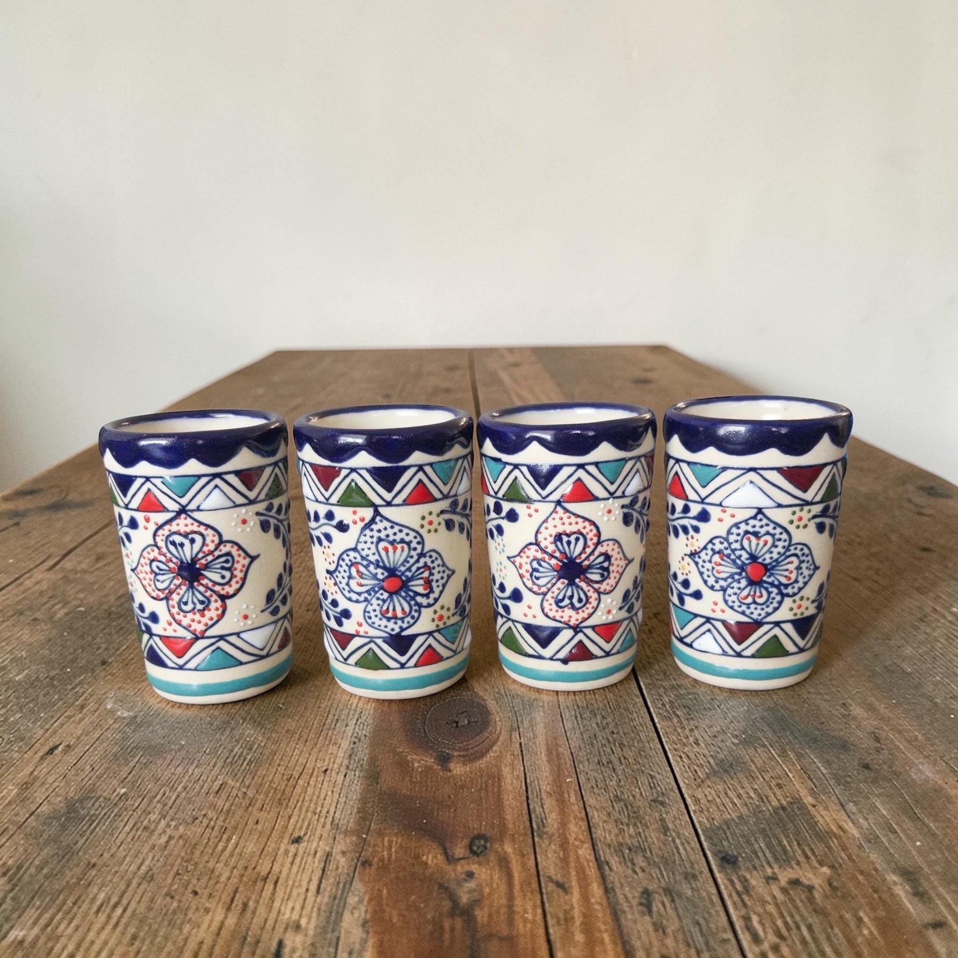 Multicolor stoneware decanter with 4 shot glasses set