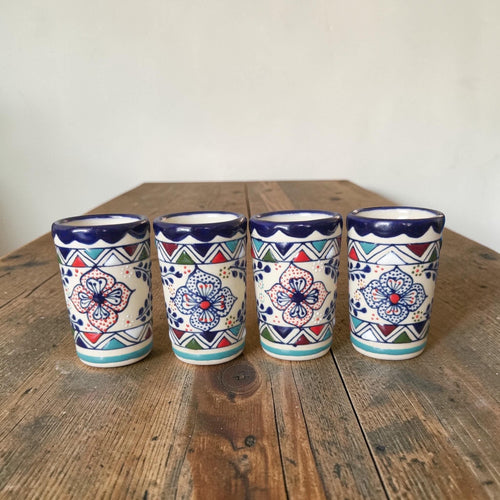 Multicolor stoneware decanter with 4 shot glasses set