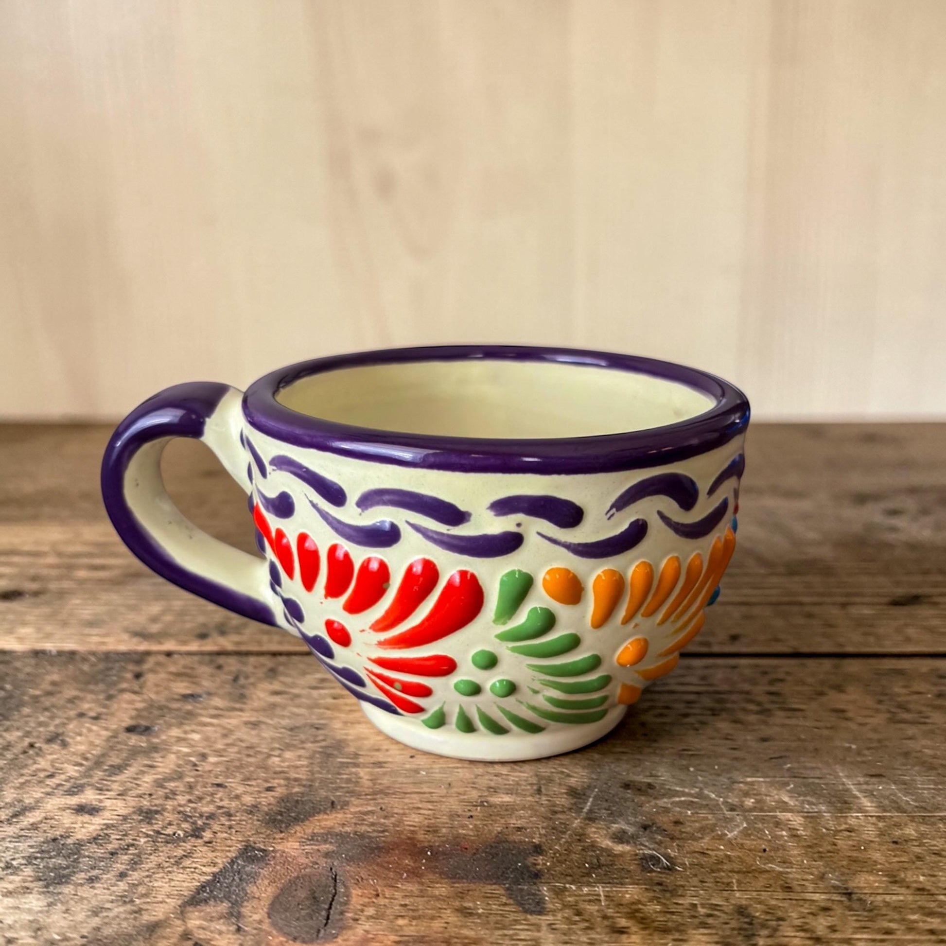 Multicolor Talavera coffee mug on kitchen table