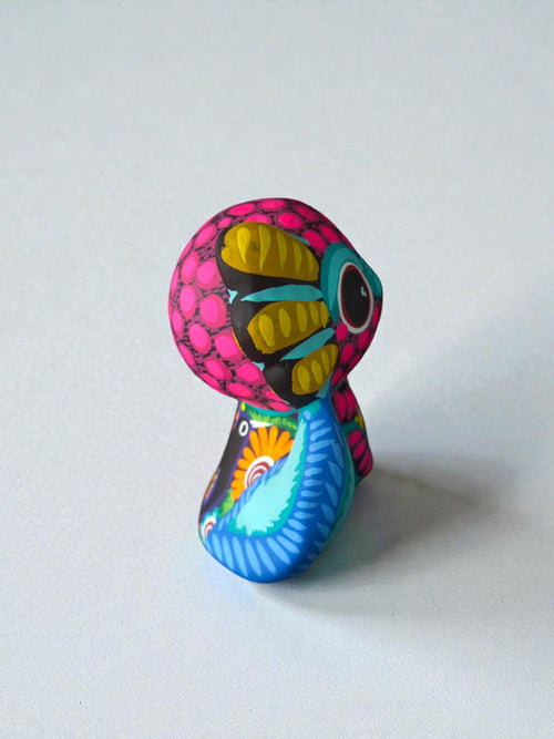 Pink axolotl alebrije detail, handpainted clay Mexican folk art