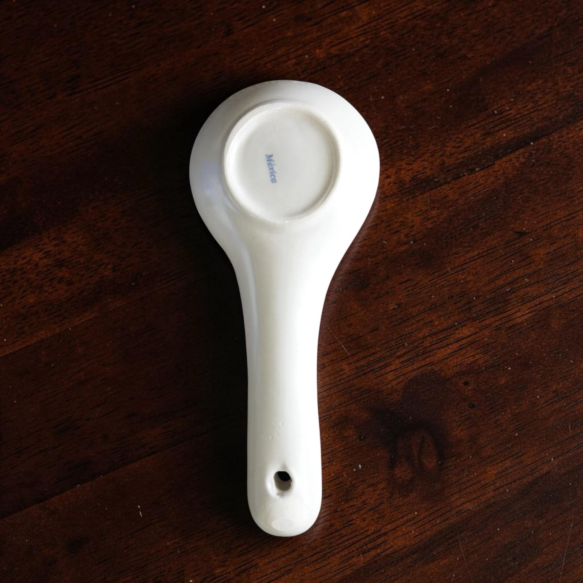 Handmade pink ceramic spoon rest for kitchen countertop
