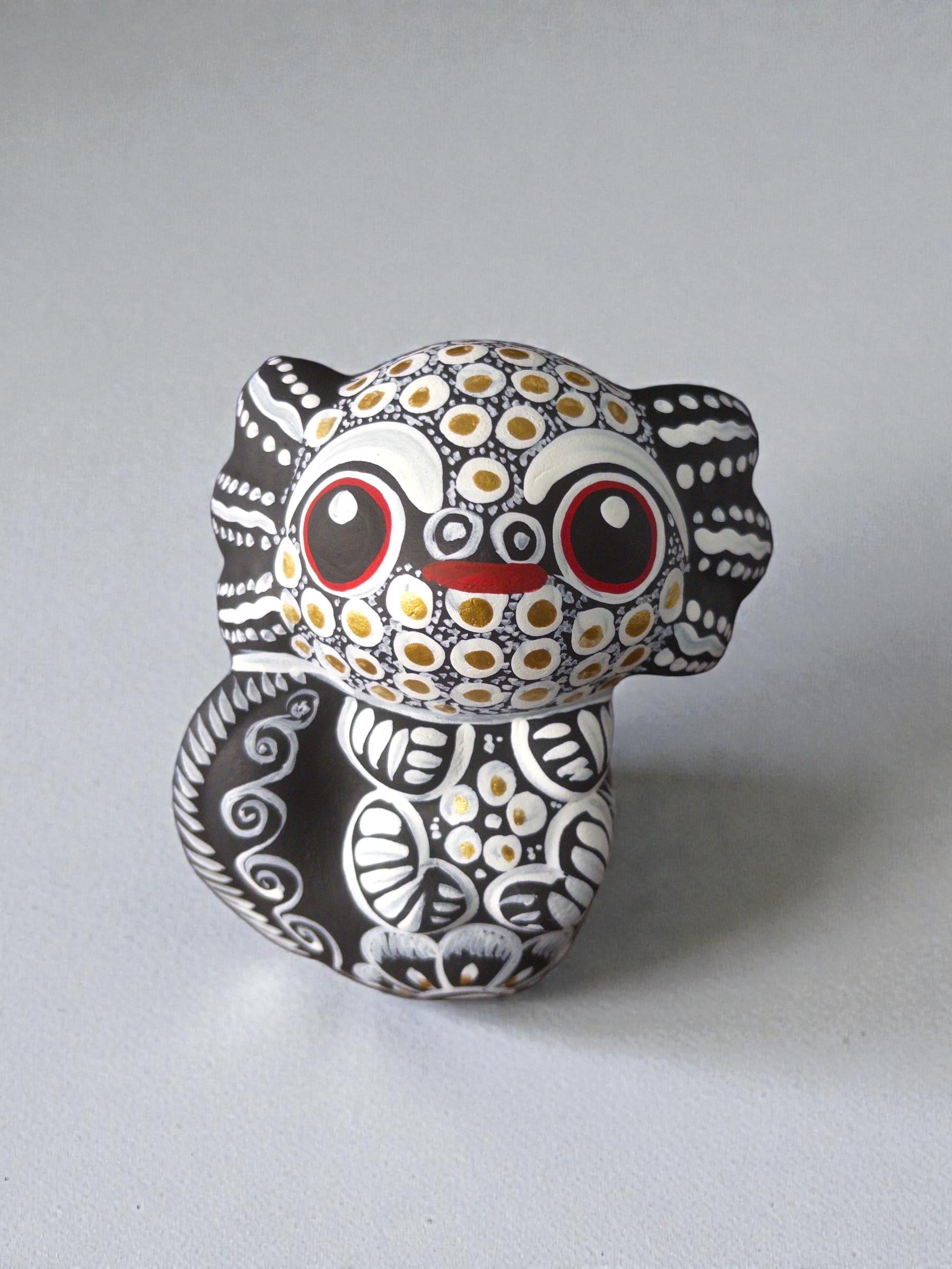 white axolotl alebrije side view, handpainted clay Mexican folk art
