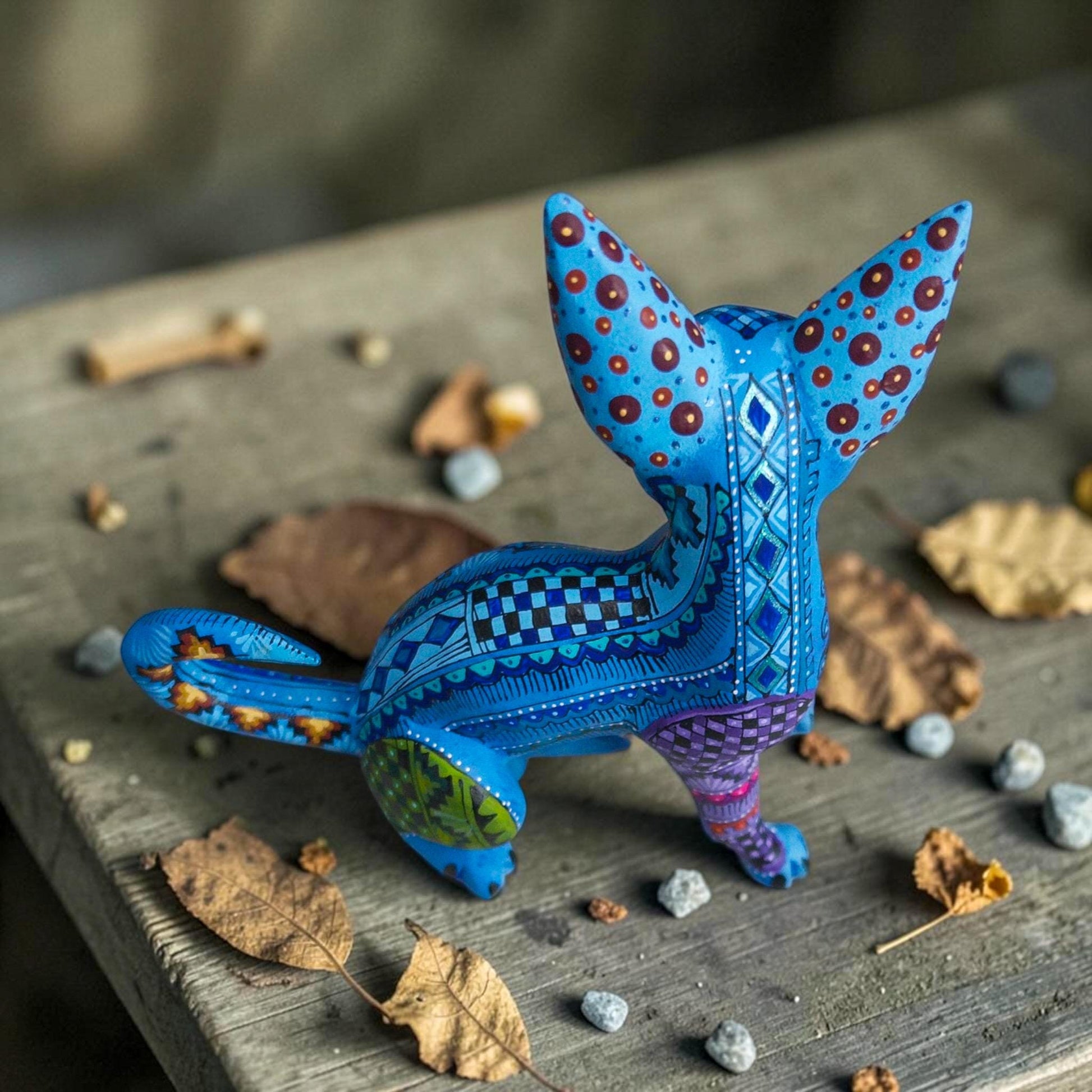 Wood dog alebrije with intricate hand-painted patterns