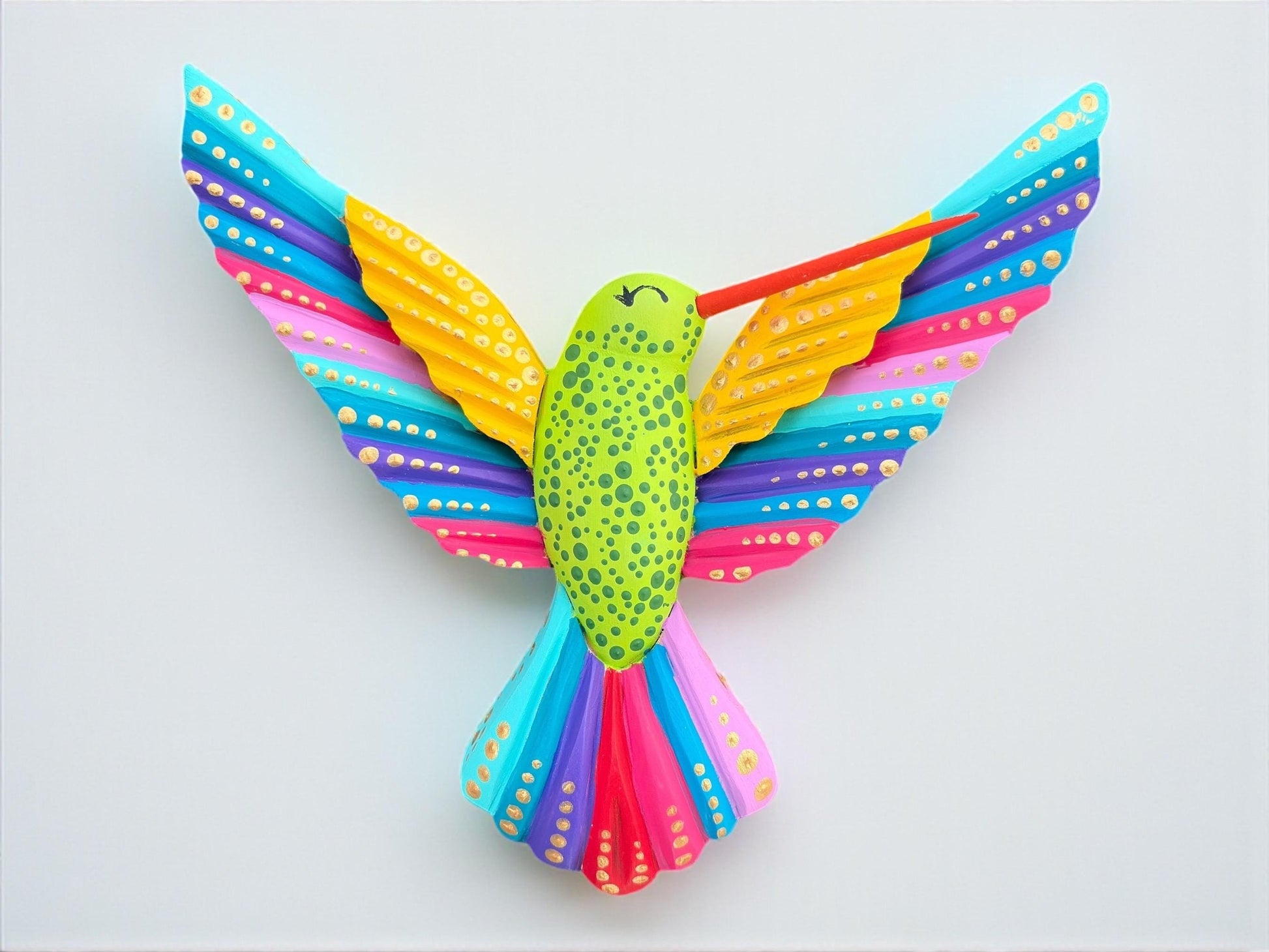 Multicolor wood hummingbird wall art angled view, handcarved Mexican folk art