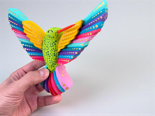 Multicolor wood hummingbird wall art detail, handpainted Mexican folk art